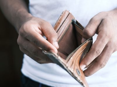 Man hand open an empty wallet with copy space - Photo by Towfiqu barbhuiya on Unsplash